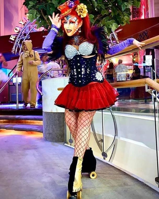 Madelyn Greco performing on roller skates in a ship’s atrium