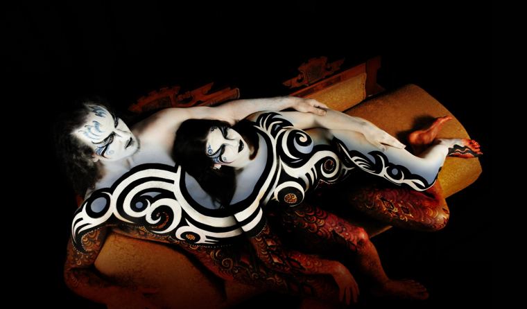 Couple painted in black and white reclining together