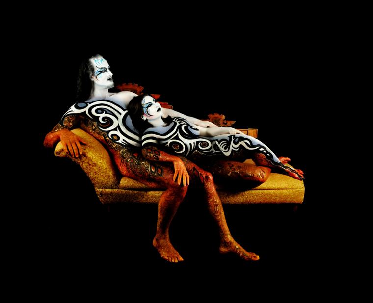 Couple painted as one design on a golden chaise