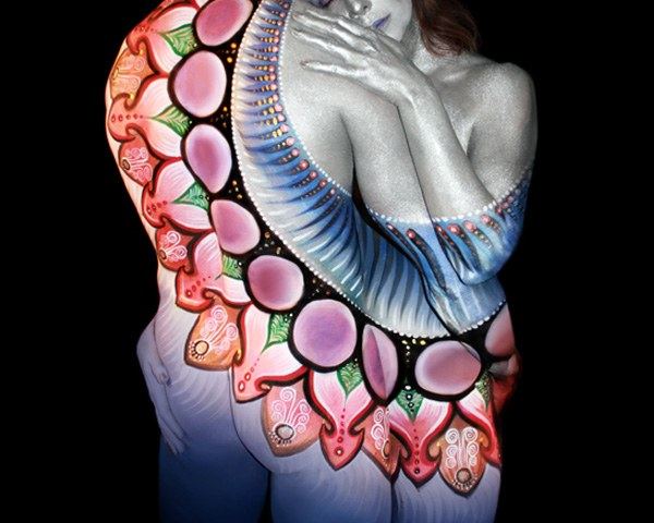 The same couple painted with a different design on their backs