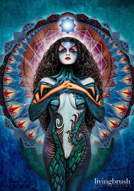 Bodypainting in teal and white, finished with a mandala halo