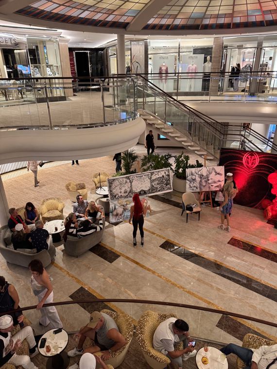 A ship’s atrium with live banners on display