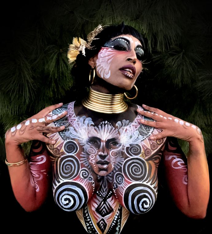 Bodypainted model with spiral patterns and a gold neck ring