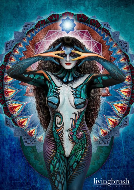 The teal piece in a second pose, hands framing the face