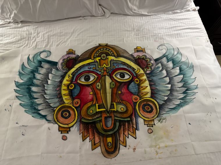 Banner of a winged ceremonial mask