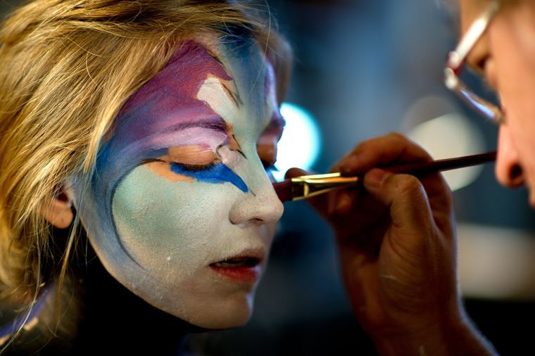 Scott Fray painting fine details around a model’s eye