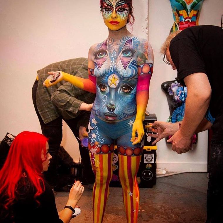 Madelyn Greco painting alongside other artists