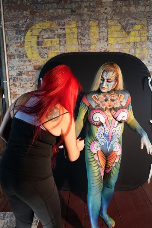 Madelyn Greco adding the final details to a bodypainting