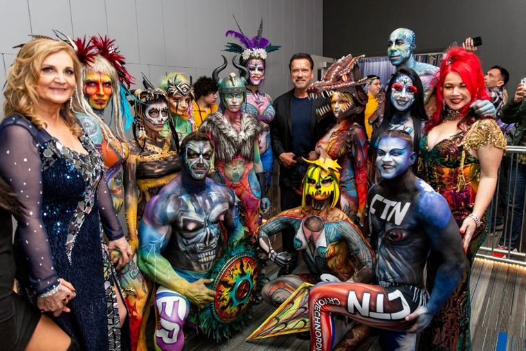 Painted models with Arnold Schwarzenegger at the festival