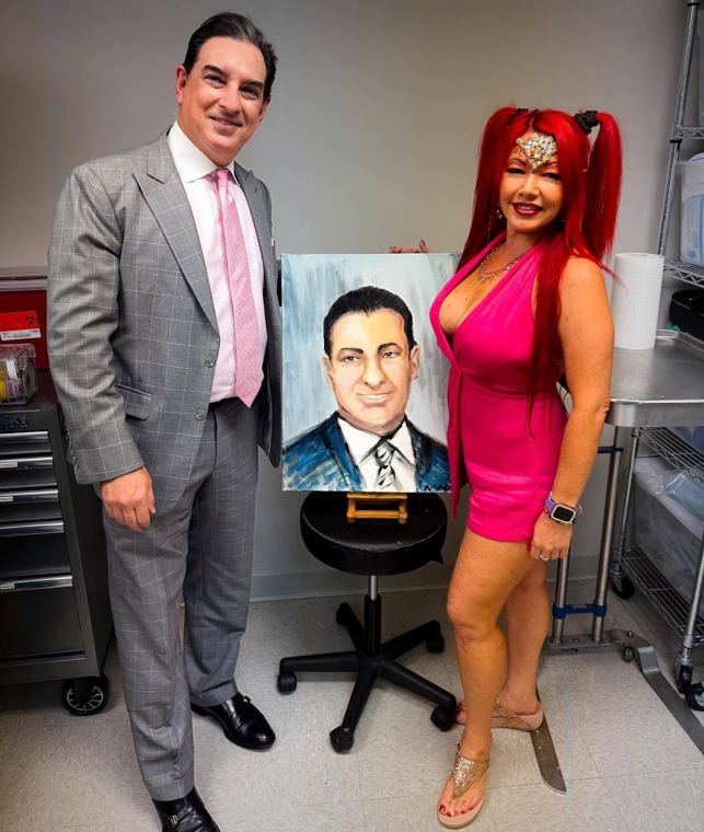 Madelyn Greco and a guest with his portrait