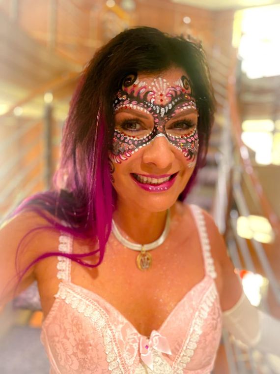 Guest with a jeweled pink mask design