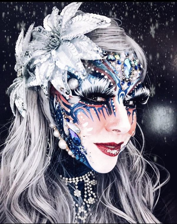 Silver and white winter facepainting with jewels