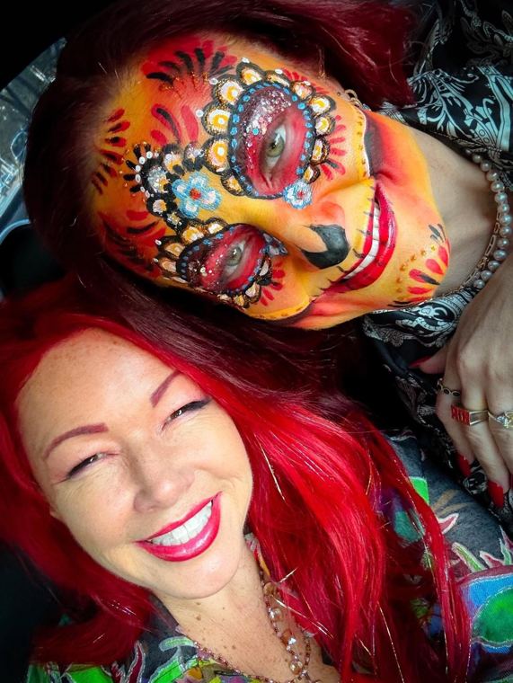 Madelyn Greco with a painted face and headdress